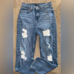 Fashion Nova woman’s Distressed Blue Jeans